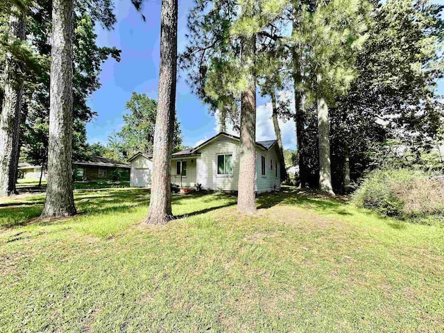 312 Temple, Woodville, TX 75979 - view of grassy yard