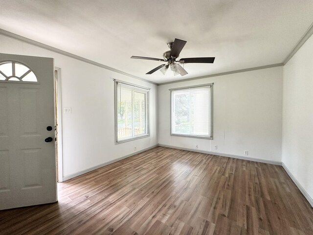 312 Temple, Woodville, TX 75979 - foyer featuring wood finished floors, crown molding, and ceiling fan