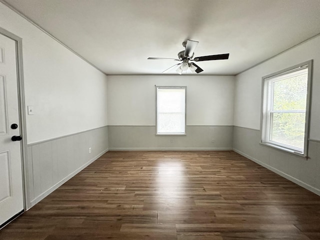 312 Temple, Woodville, TX 75979 - empty room featuring plenty of natural light, wood finished floors, and ceiling fan