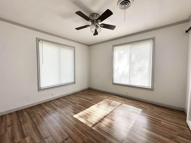 312 Temple, Woodville, TX 75979 - unfurnished room featuring crown molding, ceiling fan, and wood finished floors
