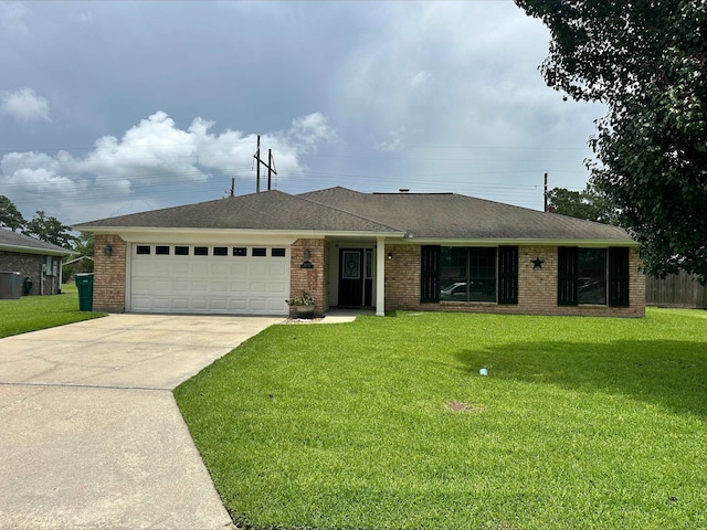 4804 Old Oak Dr, Orange, TX 77632 - single story home featuring a garage, driveway, a front yard, and brick siding