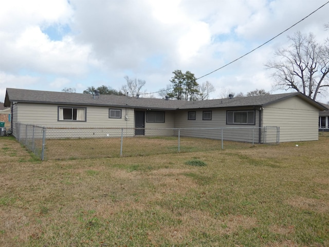 ranch-style house with central AC unit and a front lawn