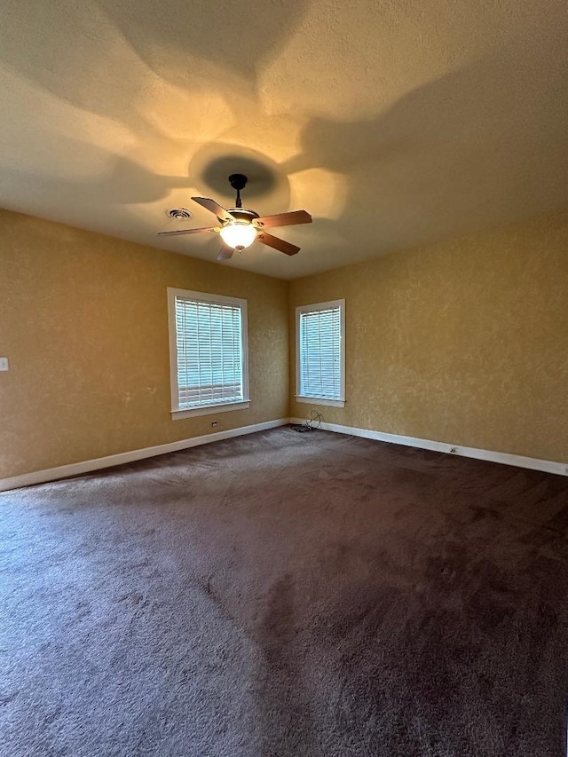 spare room with carpet flooring and ceiling fan