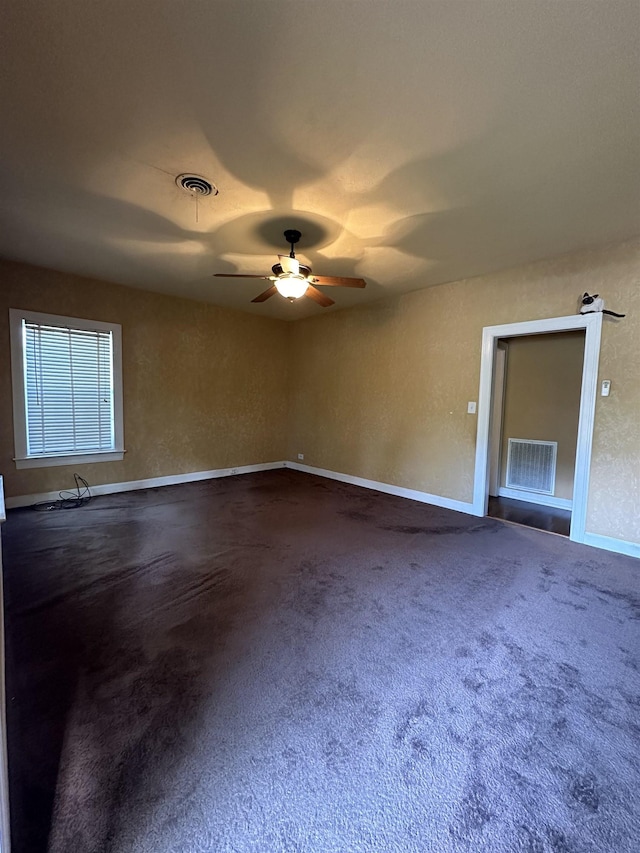 unfurnished room featuring carpet and ceiling fan