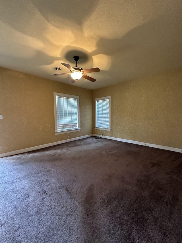 spare room with ceiling fan and carpet floors