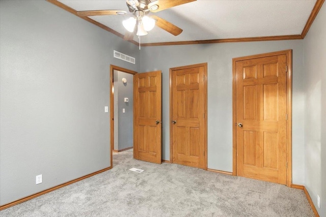 unfurnished bedroom with ceiling fan, crown molding, light carpet, and lofted ceiling