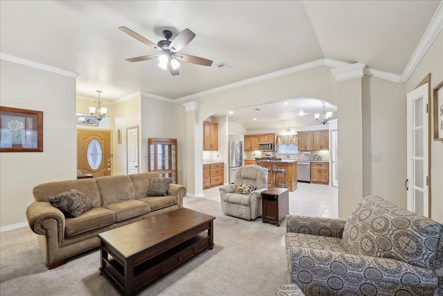 7385 Hidden Valley Dr, Beaumont, TX 77706 - living room with light carpet, a chandelier, arched walkways, ceiling fan, and crown molding