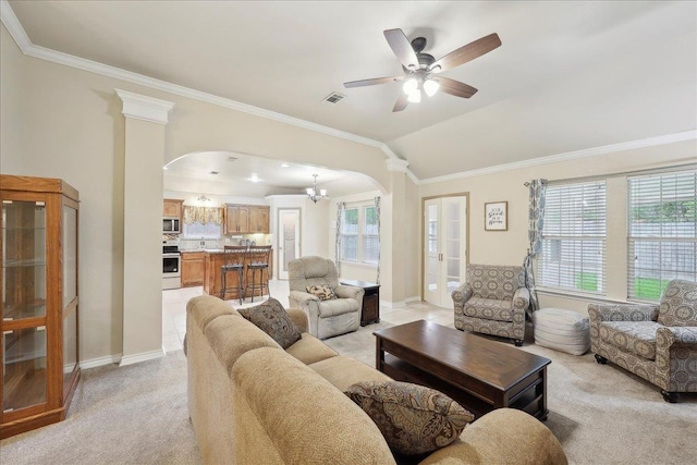 7385 Hidden Valley Dr, Beaumont, TX 77706 - living area with arched walkways, crown molding, light carpet, baseboards, and vaulted ceiling