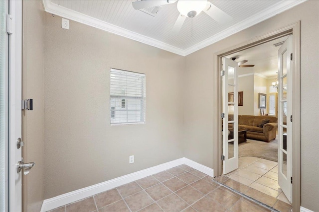 7385 Hidden Valley Dr, Beaumont, TX 77706 - empty room featuring a ceiling fan, tile patterned floors, french doors, crown molding, and baseboards