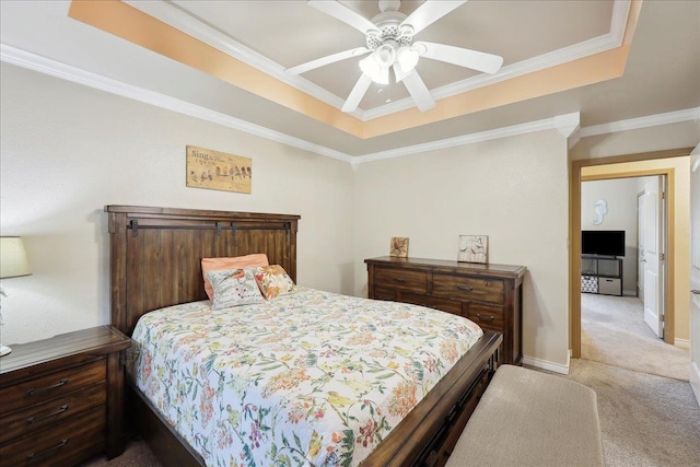 7385 Hidden Valley Dr, Beaumont, TX 77706 - bedroom featuring carpet floors, a tray ceiling, ornamental molding, baseboards, and ceiling fan