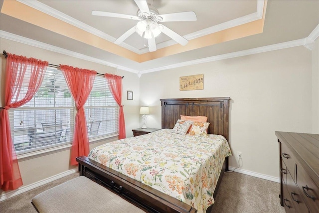 7385 Hidden Valley Dr, Beaumont, TX 77706 - bedroom with dark colored carpet, a tray ceiling, baseboards, ornamental molding, and ceiling fan