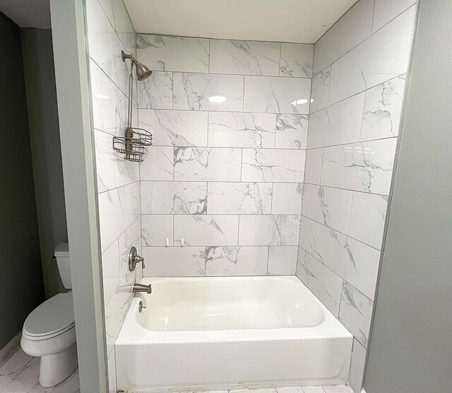 full bathroom with  shower combination, toilet, and marble finish floor