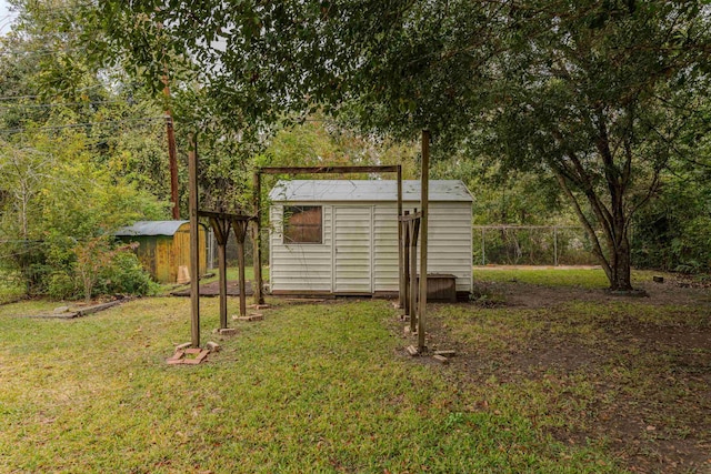 view of outdoor structure with a yard