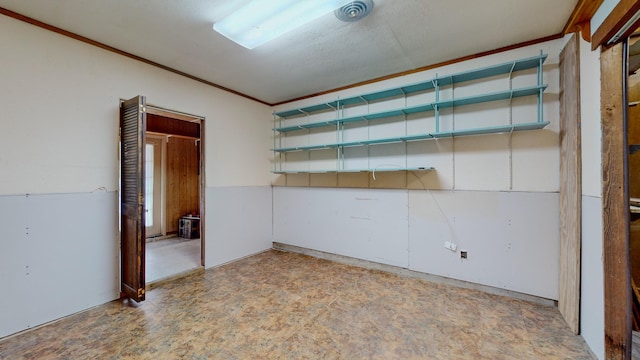 spare room featuring ornamental molding