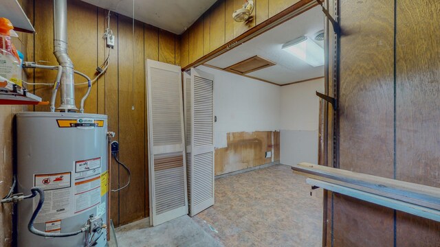 utility room with gas water heater