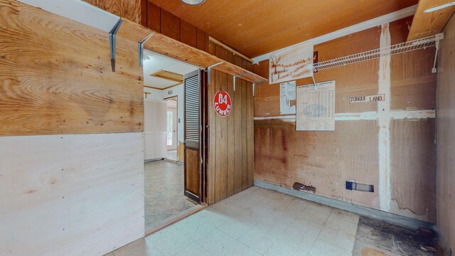 interior space featuring wooden walls