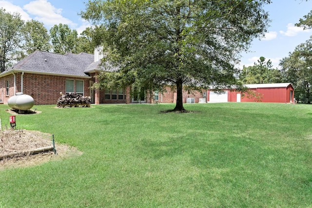 view of yard featuring a garage