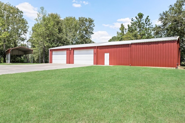 garage with a lawn and a carport