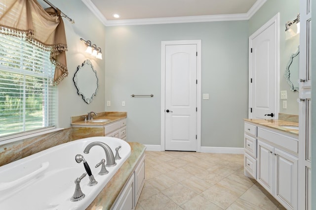 bathroom with vanity, crown molding, and a bath