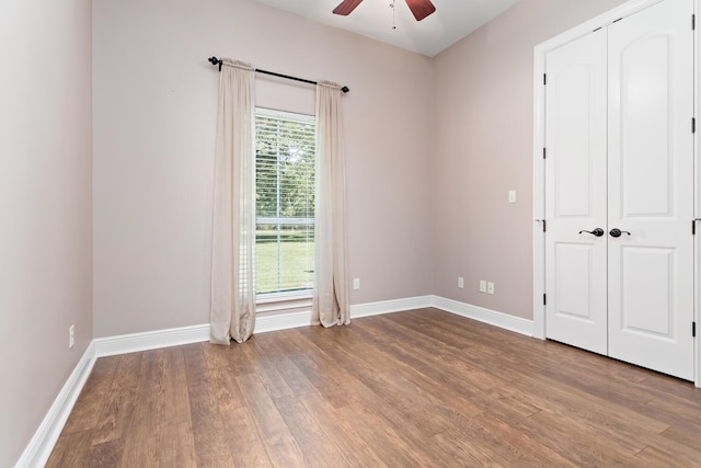 unfurnished room featuring ceiling fan and wood-type flooring