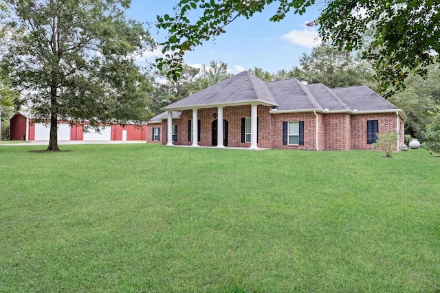 view of front facade with a garage and a front yard