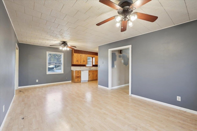 unfurnished living room featuring ceiling fan and light hardwood / wood-style floors