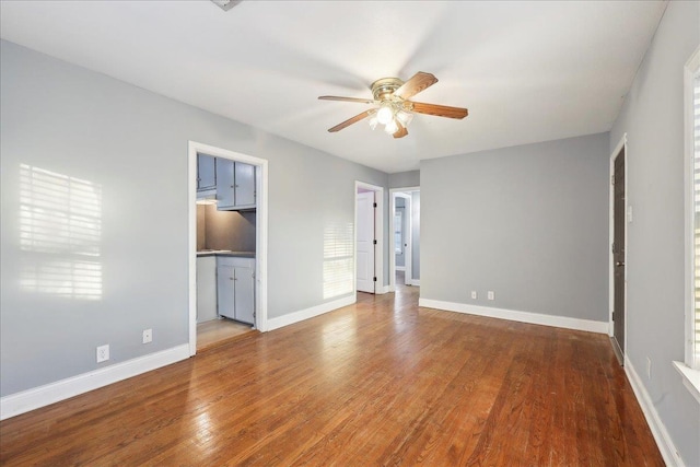 unfurnished bedroom with hardwood / wood-style flooring and ceiling fan