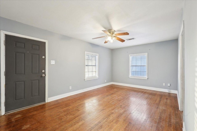 entryway with ceiling fan, hardwood / wood-style flooring, and plenty of natural light