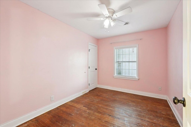 unfurnished room featuring ceiling fan and dark hardwood / wood-style flooring