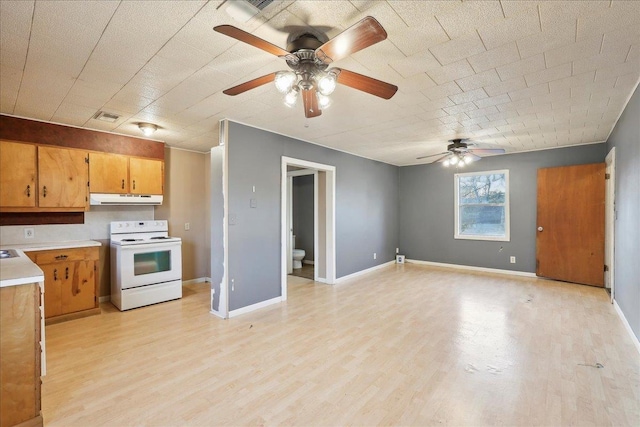 kitchen featuring white electric range and light hardwood / wood-style flooring