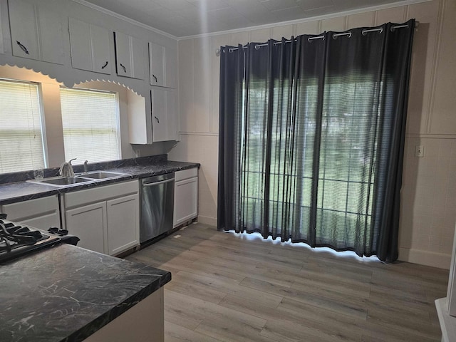 kitchen featuring light wood-type flooring, white cabinets, ornamental molding, sink, and dishwasher