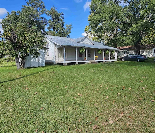 view of front of house with a porch and a front yard