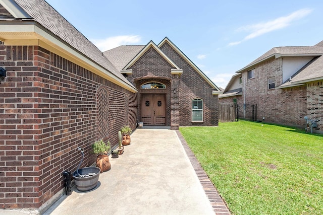 3812 Debbie Ave, Groves, TX 77619 - entrance to property featuring brick siding and a shingled roof