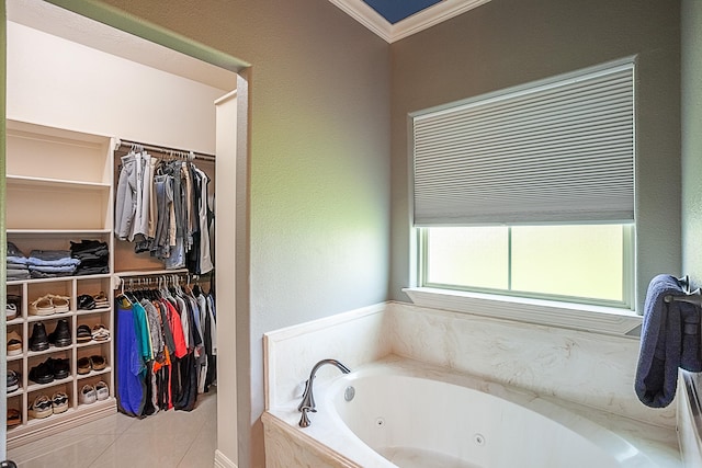 3812 Debbie Ave, Groves, TX 77619 - bathroom with a jetted tub, crown molding, and a walk in closet