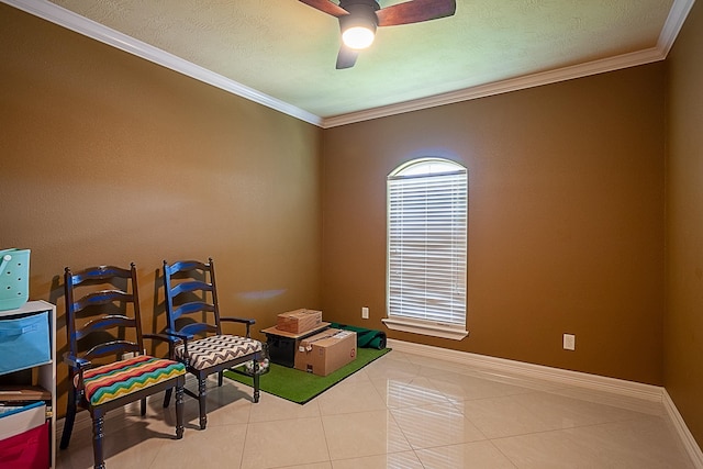 3812 Debbie Ave, Groves, TX 77619 - living area featuring a ceiling fan, tile patterned floors, ornamental molding, and baseboards