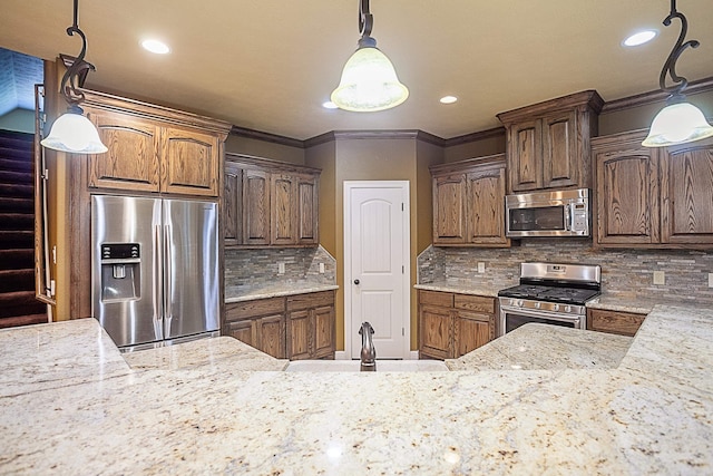 3812 Debbie Ave, Groves, TX 77619 - kitchen with stainless steel appliances, recessed lighting, light stone counters, a sink, and decorative backsplash