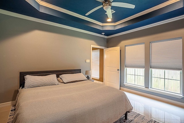 3812 Debbie Ave, Groves, TX 77619 - bedroom featuring a tray ceiling, baseboards, crown molding, and ceiling fan