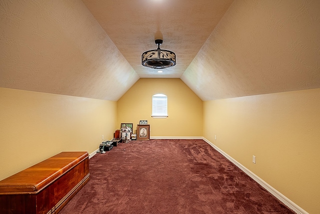 3812 Debbie Ave, Groves, TX 77619 - additional living space featuring carpet floors, vaulted ceiling, a textured ceiling, and baseboards