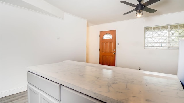 3875 Bowen Dr, Beaumont, TX 77708 - entrance foyer with ceiling fan and light wood finished floors