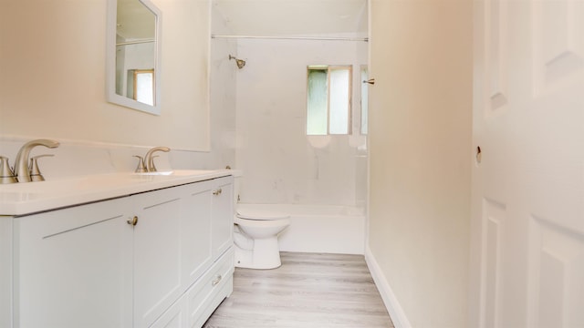 3875 Bowen Dr, Beaumont, TX 77708 - full bathroom with vanity, healthy amount of natural light, wood finished floors, and washtub / shower combination