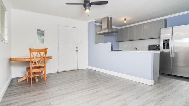 3875 Bowen Dr, Beaumont, TX 77708 - kitchen with stainless steel appliances, range hood, gray cabinetry, light wood-style floors, and crown molding