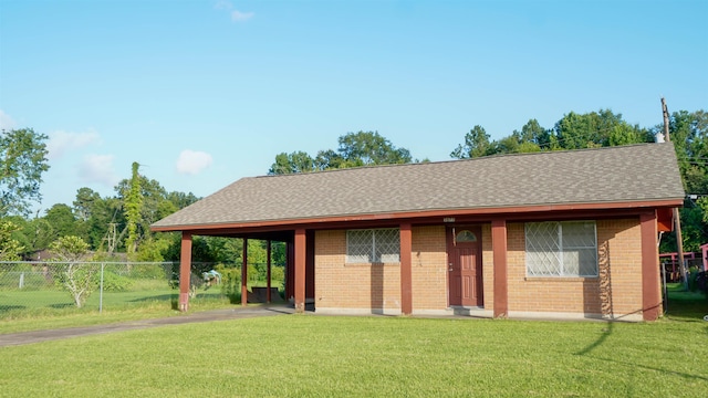 3875 Bowen Dr, Beaumont, TX 77708 - ranch-style home featuring brick siding, roof with shingles, a carport, and driveway