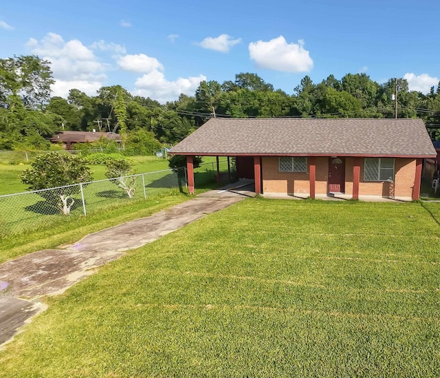 3875 Bowen Dr, Beaumont, TX 77708 - view of front facade with driveway and an attached carport