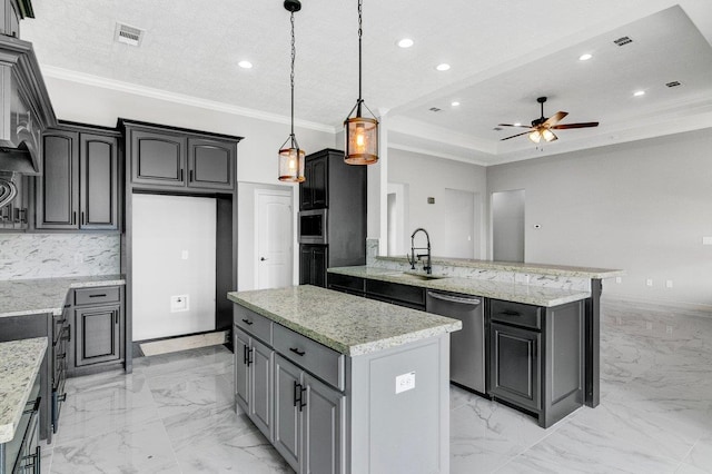 kitchen with gray cabinetry, ceiling fan, a center island, stainless steel dishwasher, and pendant lighting