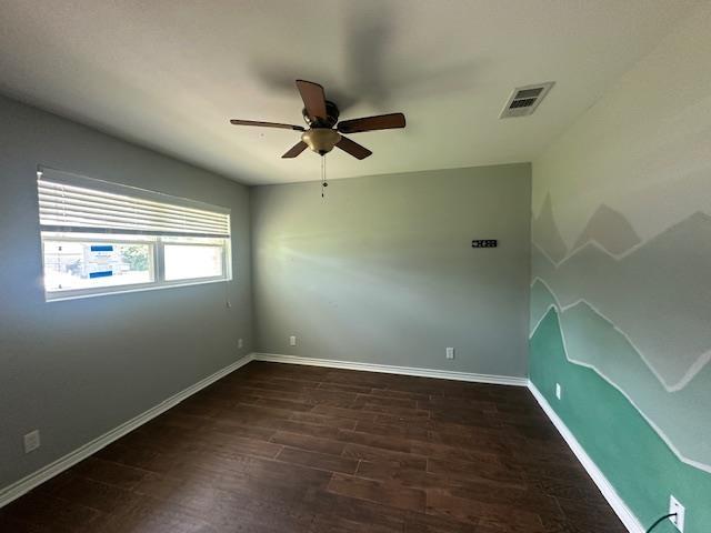 320 Meadow Dr, Bridge City, TX 77611 - empty room with ceiling fan, dark wood-style flooring, and baseboards