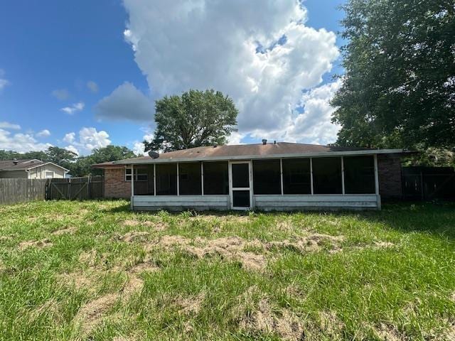 320 Meadow Dr, Bridge City, TX 77611 - back of property featuring a sunroom