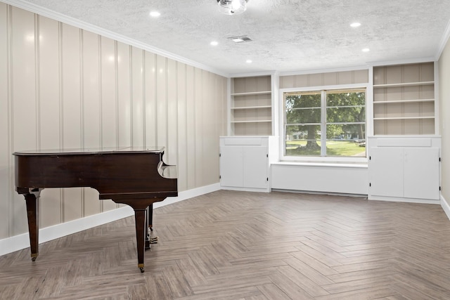 unfurnished room with a textured ceiling, ornamental molding, recessed lighting, built in features, and baseboards