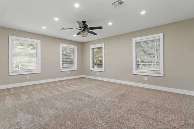 empty room featuring recessed lighting, baseboards, ceiling fan, and carpet floors