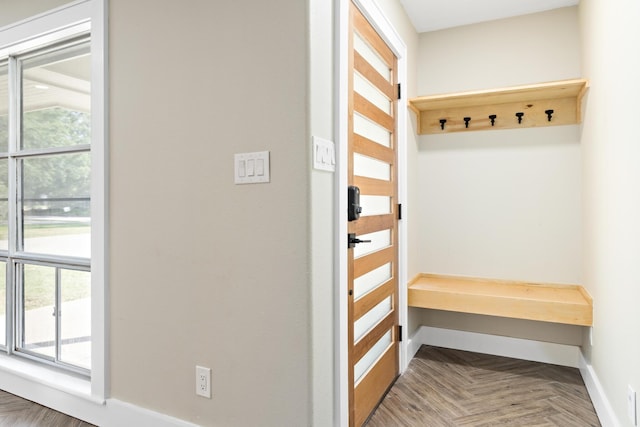 mudroom featuring baseboards and healthy amount of natural light