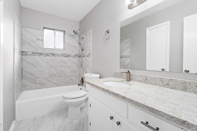 full bathroom featuring tiled shower / bath combo, vanity, and toilet